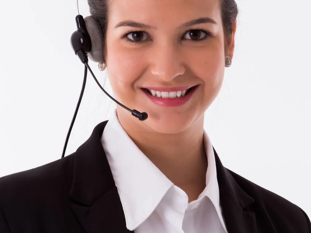 Smiling receptionist wearing a headset